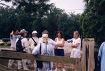 A Florida Ornithological Society group gathers beside the gate to Paynes Prairie Preserve State Park by Florida Ornithological Society