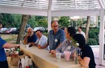 Guests laugh and celebrate at the bar during a Florida Ornithological Society meeting in Gainesville, Florida by Florida Ornithological Society