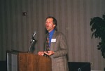 Dave Steadman presents at a podium during a Florida Ornithological Society meeting in Gainesville, Florida by Florida Ornithological Society