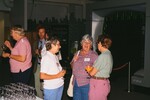Marie Slaney laughs with two other guests during a reception at the Florida Museum of Natural History by Florida Ornithological Society
