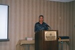 A speaker presents from behind a podium at a Florida Ornithological Society meeting in Gainesville, Florida by Florida Ornithological Society