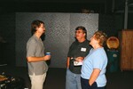 Eric Stolen chats with two guests at a Florida Ornithological Society meeting in Gainesville, Florida by Florida Ornithological Society