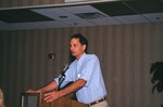 Jim Cox speaks at a podium during a Florida Ornithological Society meeting in Gainesville, Florida