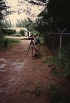 A Florida Ornithological Society member observes through a mounted camera during a birding trip in the Bahamas