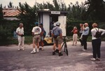 Eugene Stoccardo stands amongst a group of Florida Ornithological Society members before a Bahamas birding trip
