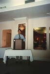 A man speaks from behind a podium to the audience at a Florida Ornithological Society meeting in the Bahamas by Florida Ornithological Society
