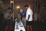 Peggy Powell and other Florida Ornithological Society members study bird skins at the 1996 fall meeting in the Bahamas by Florida Ornithological Society