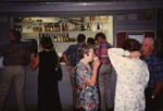 Cliques of Florida Ornithological Society members order drinks and mingle at the 1995 meeting in the Bahamas by Florida Ornithological Society