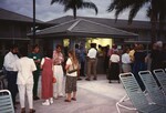 Florida Ornithological Society members mingle on the deck of a pool during the 1996 meeting in the Bahamas