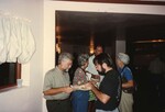 Eugene Stoccardo eats with another Florida Ornithological Society member at the 1996 meeting in the Bahamas