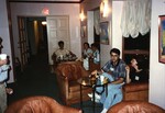 Seated Florida Ornithological Society members eat and chat during the 1996 meeting in the Bahamas