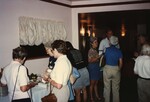 Florida Ornithological Society members mingle and serve snacks during the 1996 meeting in the Bahamas by Florida Ornithological Society