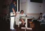 A Florida Ornithological Society member sells books and other publications at the 1996 meeting in the Bahamas
