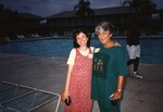 Two Florida Ornithological Society members pose in front of the pool at the 1996 meeting in the Bahamas by Florida Ornithological Society