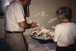 Florida Ornithological Society members serve slices of pie during the 1996 fall meeting in the Bahamas