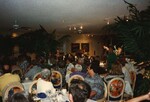 A room of seated audience members pays attention to a presenter at the Florida Ornithological Society 1996 fall meeting in the Bahamas