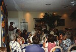A Florida Ornithological Society presenter exhibits a photograph of a waterbird during the 1996 meeting in the Bahamas