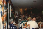 A FOS member glances at an information packet while speaking at the 1996 fall meeting in the Bahamas
