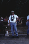 Dave Goodwin stands with a hand on his hip during a picnic at Archbold Biological Station