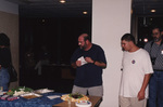 Wes Biggs, Dave Goodwin, and other guests line up for snacks during the 2000 fall Florida Ornithological Society meeting in Tallahassee, Florida by Florida Ornithological Society