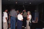 A crowd of eight guests mingle during the 2000 fall Florida Ornithological Society meeting in Tallahassee, Florida