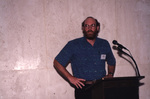 George Wallace stands at a podium during the 2000 fall Florida Ornithological Society meeting in Tallahassee, Florida by Florida Ornithological Society