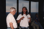 David Simpson gestures while speaking with a fellow guest at a Florida Ornithological Society meeting in Tallahassee, Florida