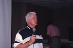 Bob Henderson speaks into a microphone during a Florida Ornithological Society meeting in Tallahassee, Florida by Florida Ornithological Society