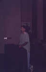 Jim Cox leans casually against a podium at the 2000 fall Florida Ornithological Society meeting in Tallahassee, Florida by Florida Ornithological Society