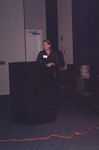A guest gestures from behind a podium while speaking at the 2000 fall Florida Ornithological Society meeting in Tallahassee, Florida