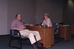 Glen Woolfenden and Dr. Fran Jones speak engagedly at a Florida Ornithological Society meeting in Tallahassee, Florida