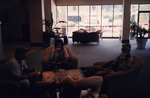 Four guests lounge in the lobby of the DoubleTree Hotel in Tallahassee, Florida by Florida Ornithological Society