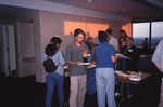 Eric Stolen, Marie Slaney, and other guests grab snacks at a Florida Ornithological Society meeting in Tallahassee, Florida