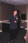 Jerry Jackson holds a presentation remote while speaking during a Florida Ornithological Society meeting in Tallahassee, Florida by Florida Ornithological Society