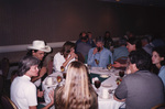 Julie Hovis and Chuck Hess chat at a dinner table during a Florida Ornithological Society meeting in Tallahassee, Florida