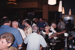 Crowds of Florida Ornithological Society members mingle at the bar during a Florida Ornithological Society meeting in Tallahassee, Florida