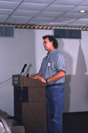 Dave Breininger stands behind a podium at a Florida Ornithological Society meeting in Titusville, Florida