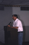 A speaker stands behind a podium at a Florida Ornithological Society meeting in Titusville, Florida