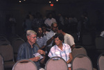Audience members discuss informational materials during a Florida Ornithological Society meeting in Titusville, Florida