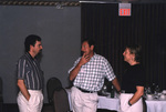 Bill Pranty and Linda Douglas stand chatting during a Florida Ornithological Society meeting in Titusville, Florida by Florida Ornithological Society