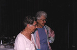 Two guests smile while observing a Florida Ornithological Society meeting in Titusville, Florida