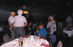 Guests mingle in a large banquet hall at a Florida Ornithological Society meeting in Titusville, Florida