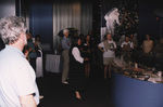 Guests smile while observing National Aeronautics and Space Administration (NASA) memorabilia in Titusville, Florida by Florida Ornithological Society
