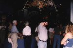 Guests mingle with drinks in a large room of National Aeronautics and Space Administration (NASA) memorabilia in Titusville, Florida