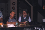 Two guests sit idly at the bar during a Florida Ornithological Society meeting in Titusville, Florida by Florida Ornithological Society