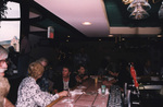 Linda Douglas chats at the bar during a Florida Ornithological Society meeting in Titusville, Florida