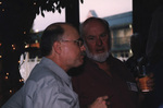 John Douglas listens as a companion speaks in Titusville, Florida