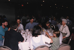 Dave Leonard, Todd Engstrom, and Peggy Powell dine at a round banquet table in Titusville, Florida