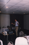 Dr. Ross Hinkle speaks animatedly during a presentation in Titusville, Florida