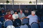A guest turns in her chair to speak to people behind her at a Florida Ornithological Society meeting in Fort Pierce, Florida